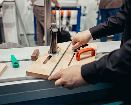 Guiding timber through a precision table saw
